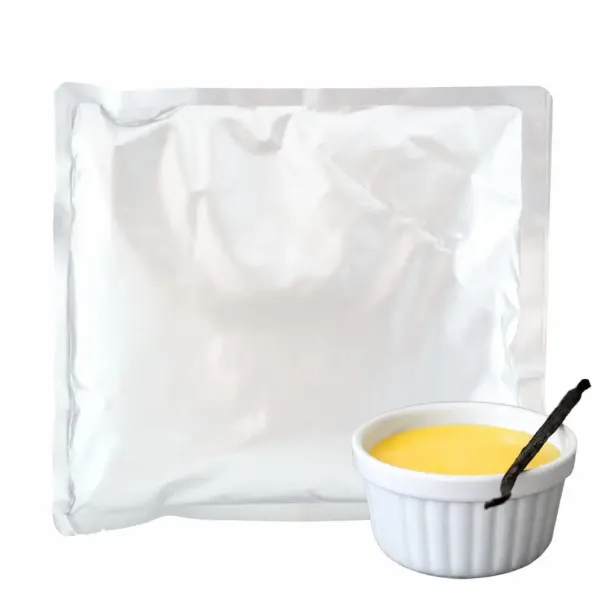 Foil pouch with a small white ramekin of yellow custard beside it, suggesting packaged dessert mix or ready-made dessert.
